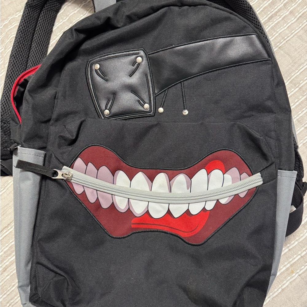 Edgy Black and Gray Backpack with Graphic Design